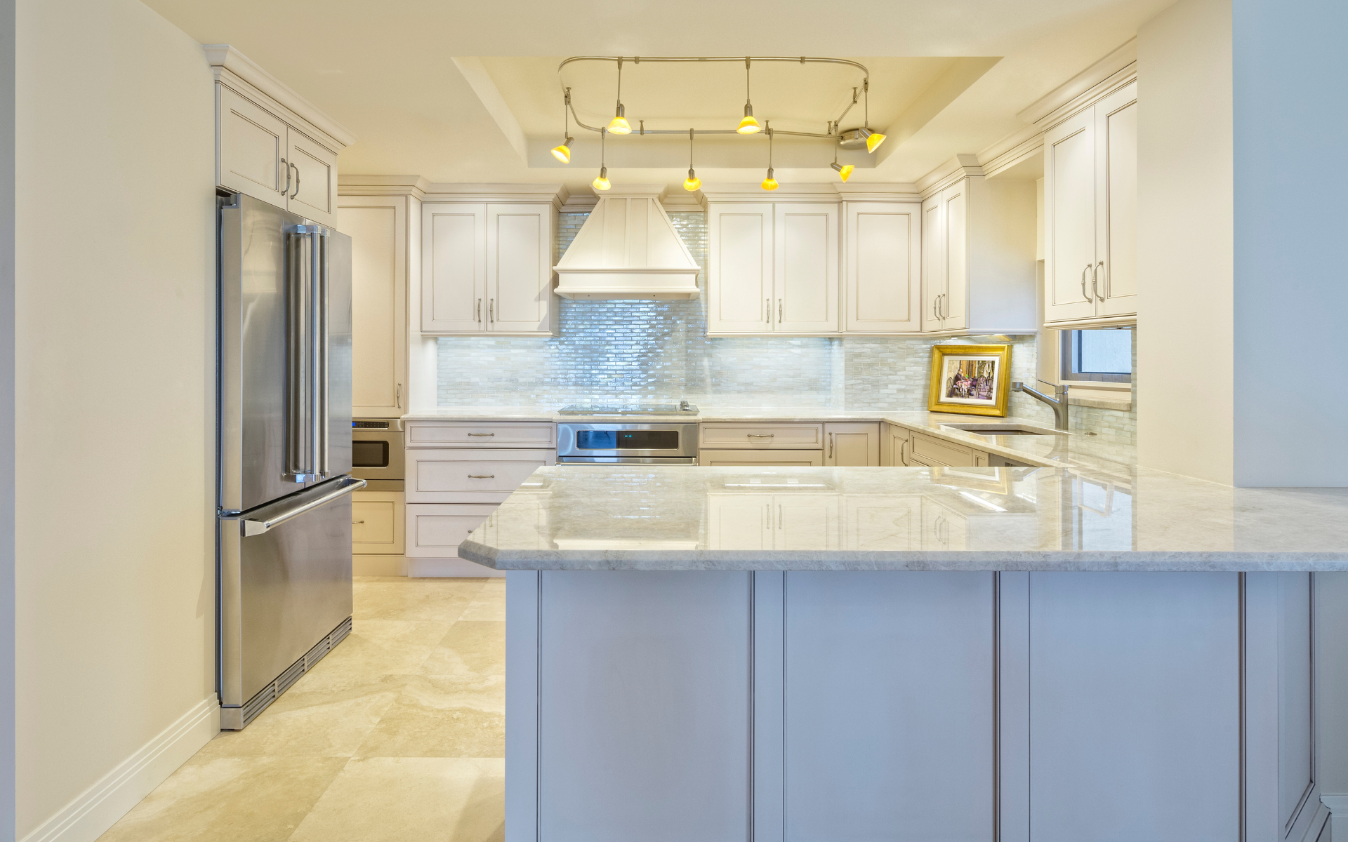 White kitchen cabinets and stainless steel refrigerator in modern kitchen
